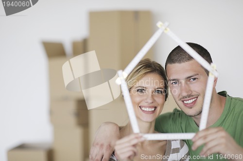 Image of Young couple moving in new home