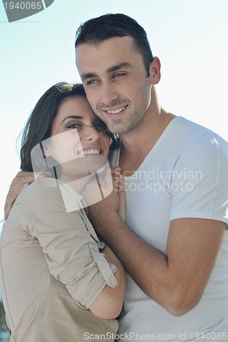 Image of couple relaxing on balcony