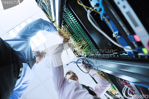 Image of it enineers in network server room