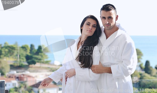 Image of couple relaxing on balcony