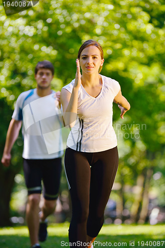 Image of Young couple jogging