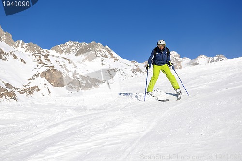 Image of skiing on fresh snow at winter season at beautiful sunny day