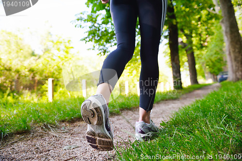 Image of Young beautiful  woman jogging