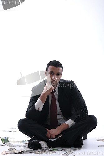 Image of Business man holding money