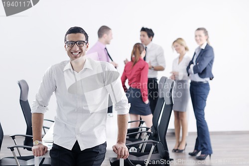 Image of young business man at meeting