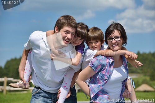 Image of happy young family have fun outdoors