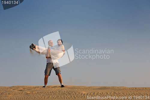 Image of couple enjoying the sunset