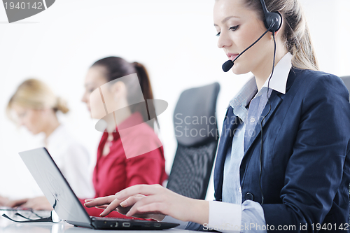 Image of business woman group with headphones