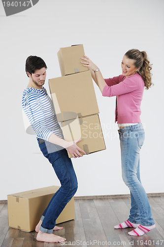 Image of Young couple moving in new house