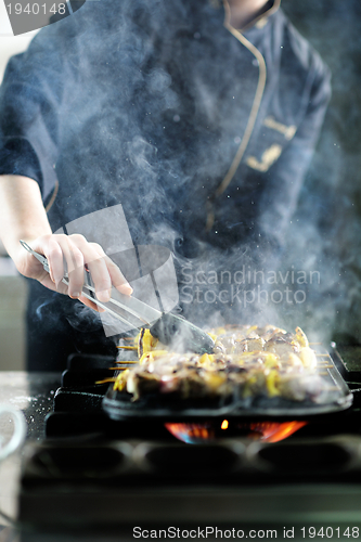 Image of chef preparing meal
