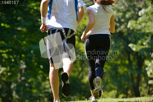 Image of Young couple jogging