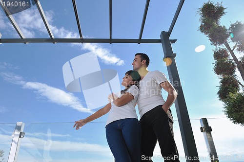 Image of couple relaxing on balcony