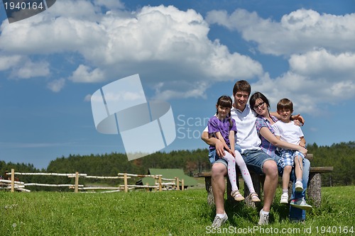 Image of happy young family have fun outdoors