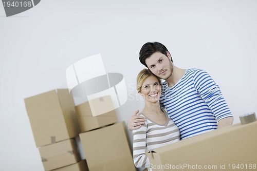 Image of Young couple moving in new home