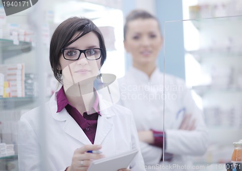 Image of team of pharmacist chemist woman  in pharmacy drugstore