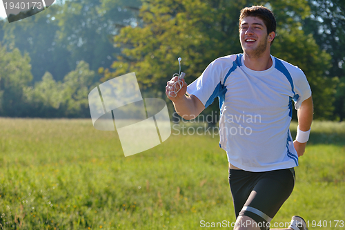 Image of Young couple jogging at morning