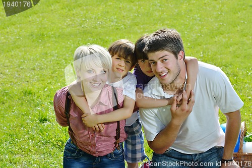 Image of happy young family have fun outdoors