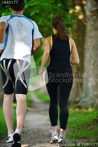 Image of Young couple jogging