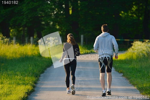 Image of Young couple jogging