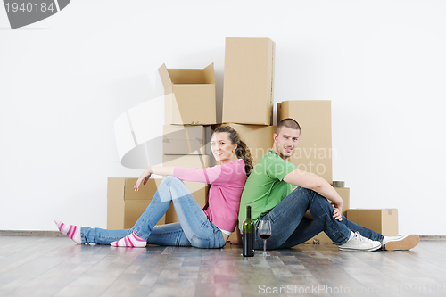 Image of Young couple moving in new house