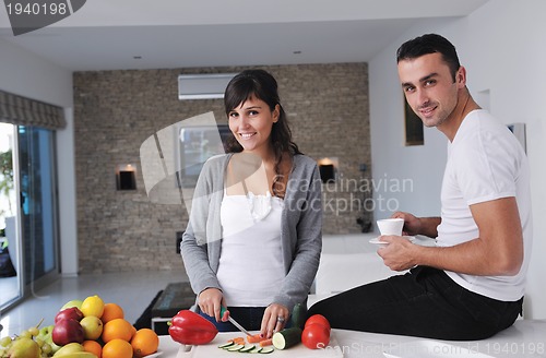 Image of young couple have fun in modern kitchen