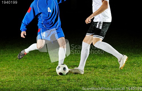 Image of football players in action for the ball