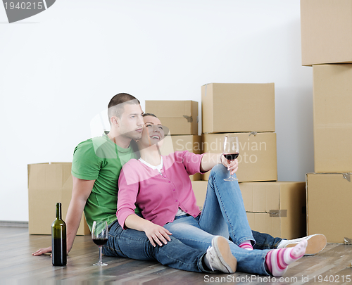 Image of Young couple moving in new house