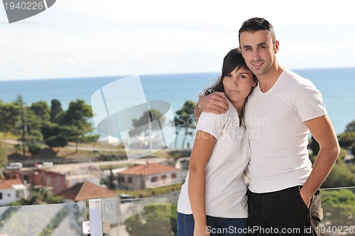 Image of couple relaxing on balcony