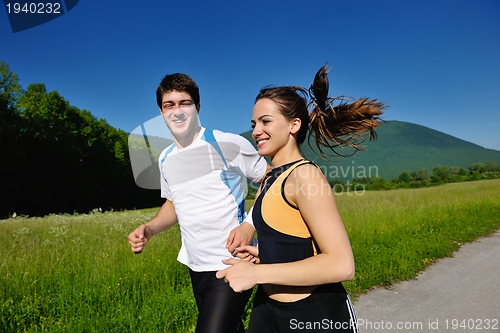 Image of Young couple jogging