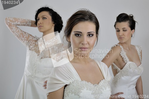 Image of portrait of a three beautiful woman in wedding dress