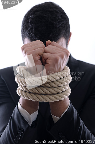 Image of business man with rope isolated on white background