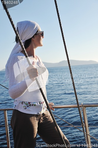 Image of Greek woman on the streets of Oia, Santorini, Greece