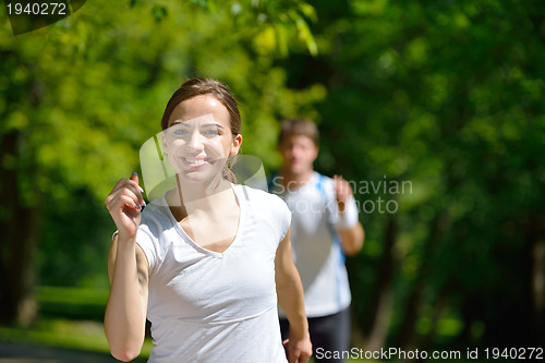 Image of Young couple jogging