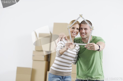 Image of Young couple moving in new home