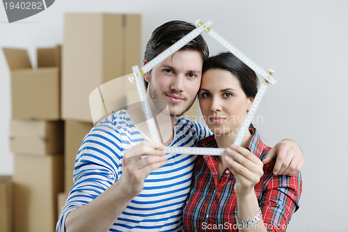 Image of Young couple moving in new house