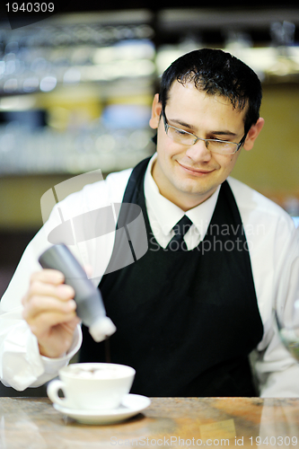 Image of Barista prepares cappuccino