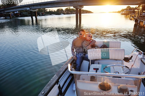 Image of couple in love  have romantic time on boat