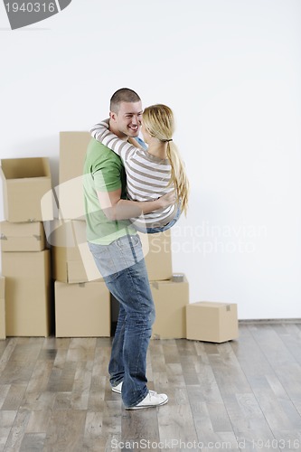 Image of Young couple moving in new home