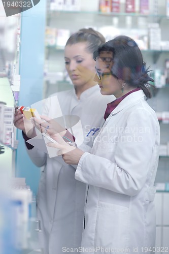 Image of team of pharmacist chemist woman  in pharmacy drugstore