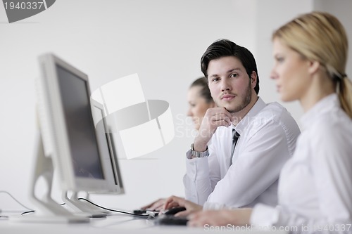 Image of business people group working in customer and help desk office