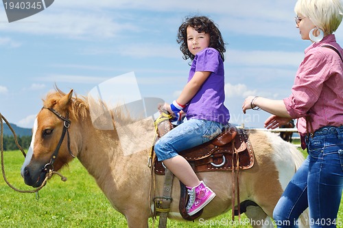 Image of child ride pony