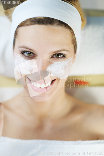 Image of Beautiful young woman in spa