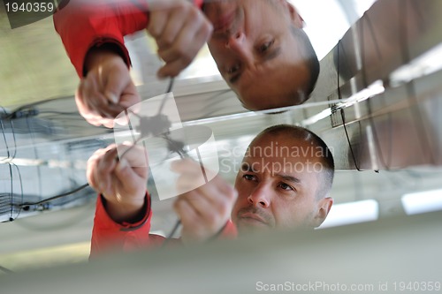 Image of Male solar panel engineer at work place