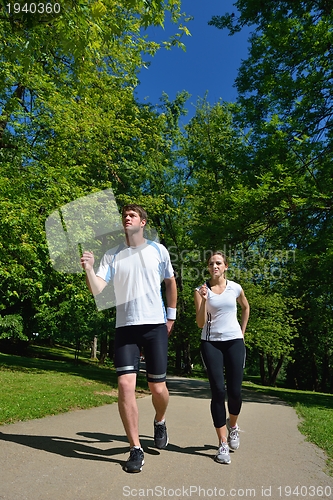 Image of Young couple jogging at morning