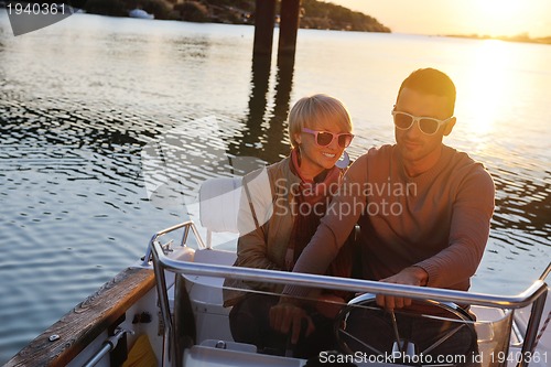 Image of couple in love  have romantic time on boat