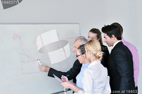 Image of Senior business man giving a presentation