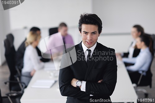 Image of young business man at meeting