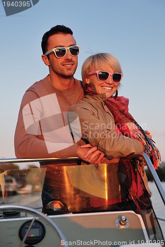 Image of couple in love  have romantic time on boat