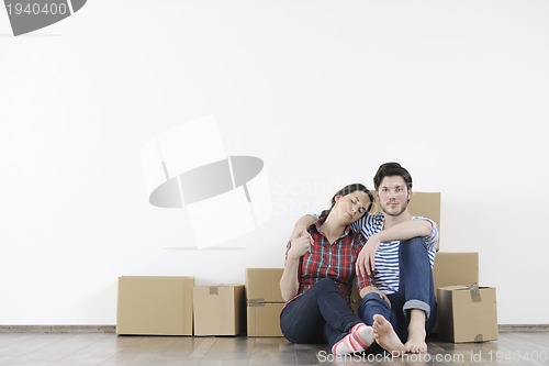 Image of Young couple moving in new home