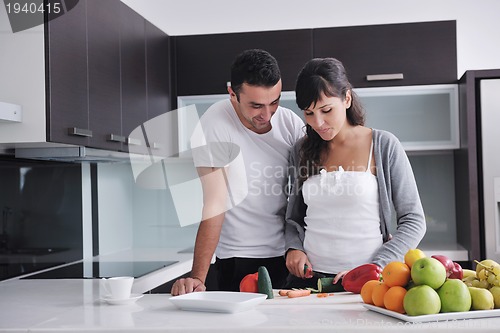 Image of young couple have fun in modern kitchen